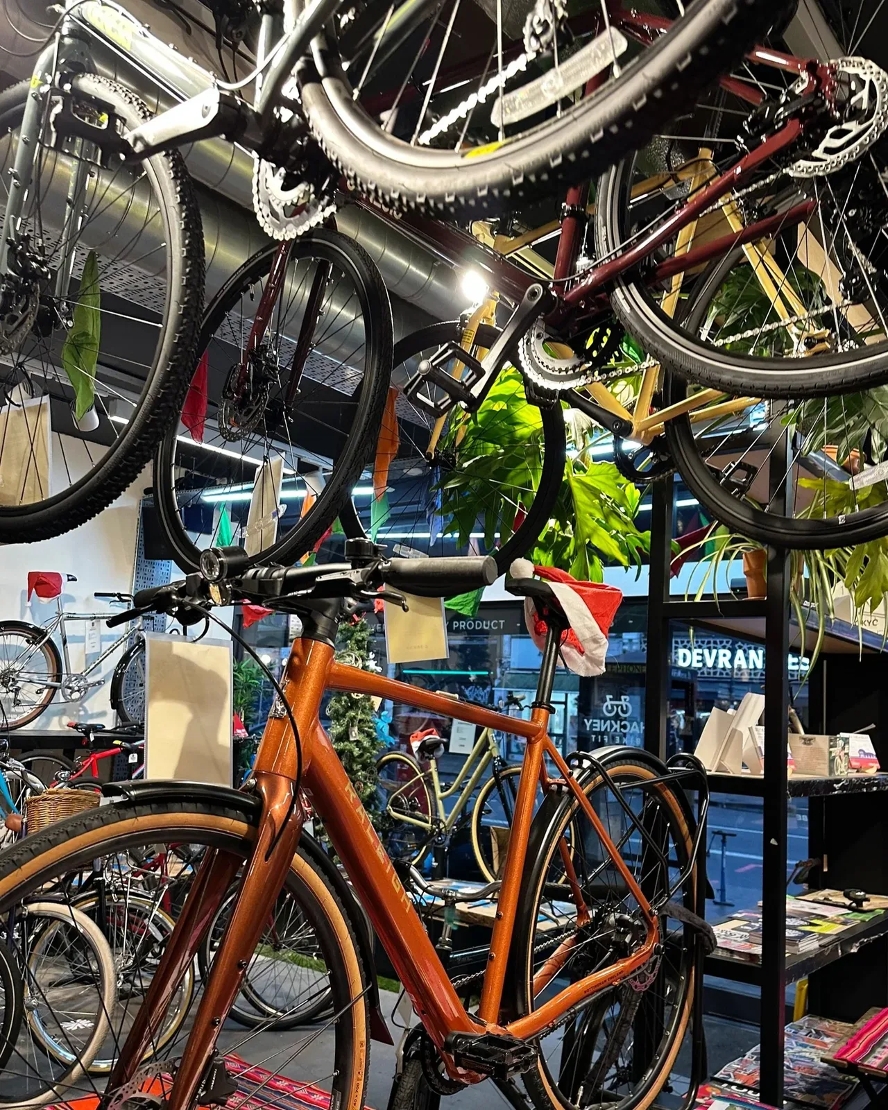 Bikes hanging above the workshop floor at London Bike Studio